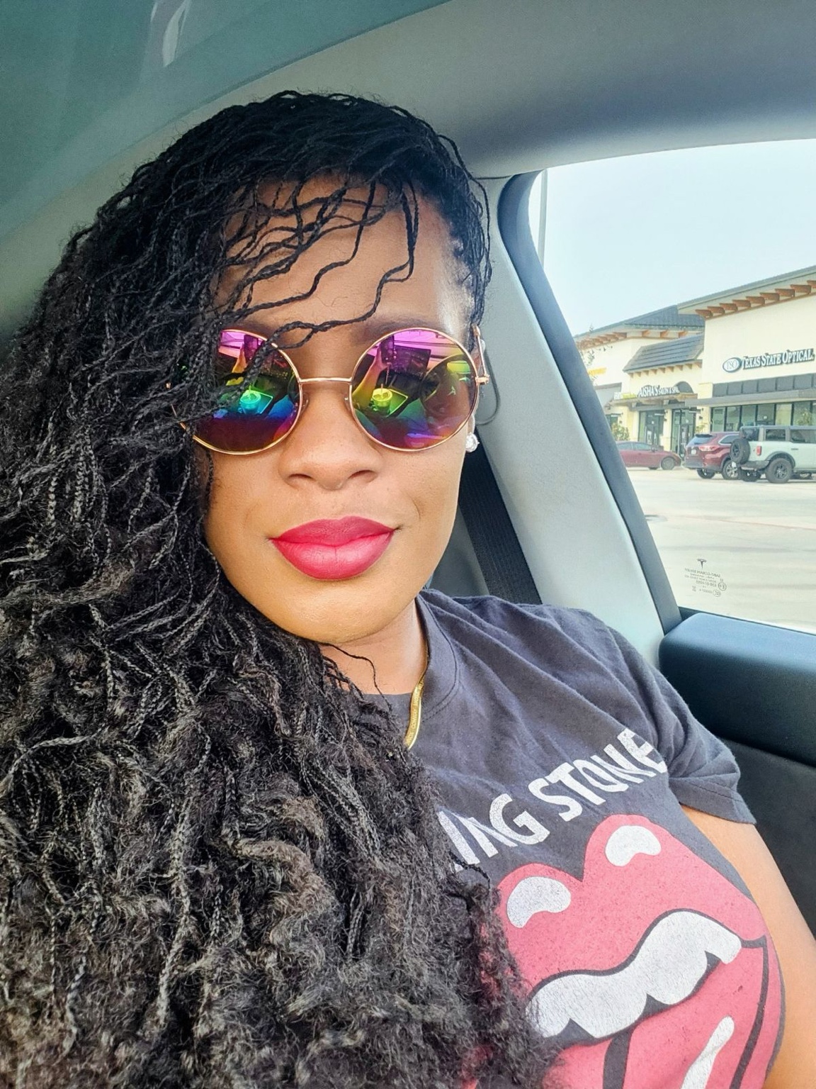 Swann Stylez client showcasing professionally maintained locs